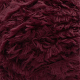 Swatch of Red Heart Hygge Fur textured yarn in sangria (deep burgundy/wine)