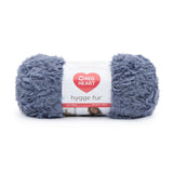 Ball of Red Heart Hygge Fur textured yarn in slate blue (pale blue/grey)