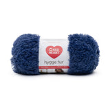Ball of Red Heart Hygge Fur textured yarn in blue mist (dark blue)