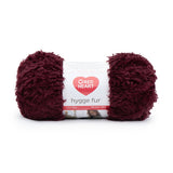 Ball of Red Heart Hygge Fur textured yarn in sangria (deep burgundy/wine)