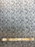 Flat swatch silver reflective fabric with black abstract/scratched look