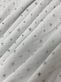 Swirled swatch silver foil stars printed fabric on white