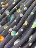 Swirled swatch knit material in space brushed blue (space sky with planets and stars on deep blue)
