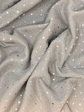 Crinkled swatch silver foil stars printed fabric on grey