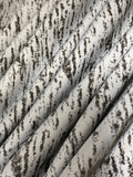 Swirled swatch silver reflective fabric with black abstract/scratched look