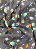 Crinkled swatch knit material in space brushed blue (space sky with planets and stars on deep blue)