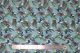 Flat swatch winter flannel in pinecones on blue (pale blue fabric with tossed green and brown tree sprigs and pinecones, blue leaves, white floral)