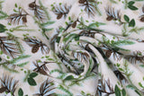 Swirled swatch winter flannel in pinecones on cream (cream fabric with tossed green and brown tree sprigs and pinecones, green leaves, white floral)