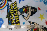 Flat swatch Wonder Woman licensed print on fleece (text, stars, and superhero on white)