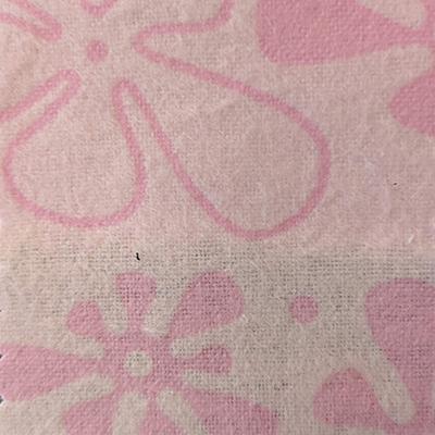 Swatch of light pink flannel fabric printed with slightly darker pink 'groovy' flowers that somewhat resemble amoebas.