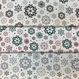 Group swatch snowflake variety printed fabric in various colours