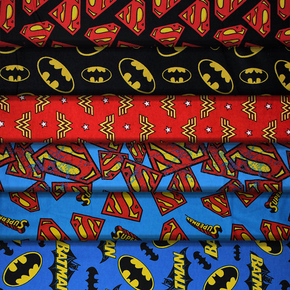 Group swatch assorted DC comic printed cotton flannel fabrics in various styles/colours
