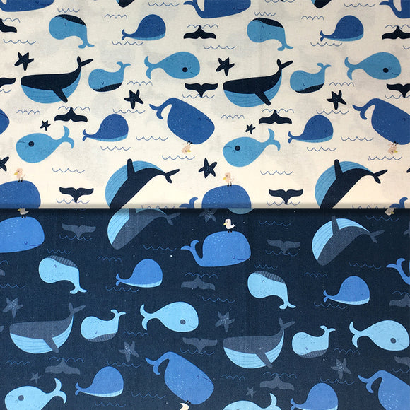 Group swatch cartoon whales fabric in blue and white