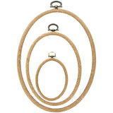 Group photo Plastic Woodgrain Hoops (oval) in sizes 2"x3", 4"x5", and 5"x7" on white background