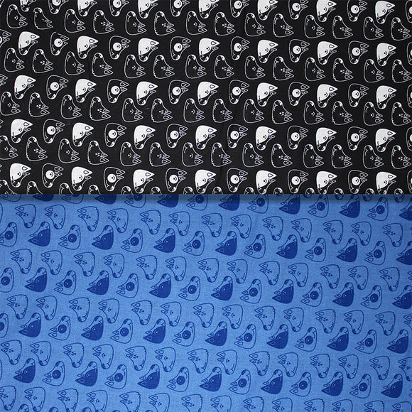 Group swatch of puppy heads printed fabric in black and blue