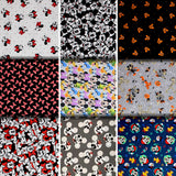 Group swatch assorted Mickey and Minnie Mouse printed cotton fabrics in various styles/colours