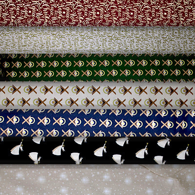 Group swatch Oh Holy Night themed Christmas fabrics in a variety of styles