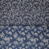 Group swatch assorted denim look fabrics with floral designs in dark and light