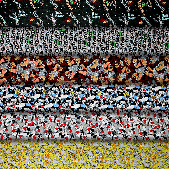 Group swatch assorted Looney Tunes themed fabrics in various styles/colours