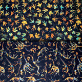 Group swatch assorted Prehistoric themed fabrics in various styles/colours