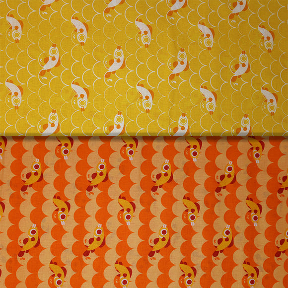 Group swatch cartoon fish and scales printed fabric in yellow and orange