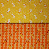 Group swatch cartoon fish and scales printed fabric in yellow and orange