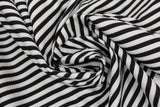 Swirled swatch lines & stripes printed fabric in black & white stripes