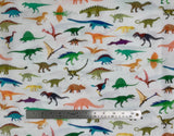 Flat swatch Alphabetosaurus fabric (white fabric with illustrative style dinos allover in full colour tossed)