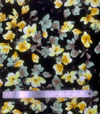 Flat swatch Bloom Sateen Print fabric (black fabric with realistic look floral allover in white and yellow and pale purple on branches)