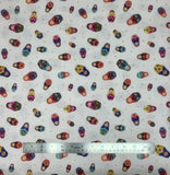 Little Matryoshka fabric swatch in cream (cream fabric with grey tossed dots and full colour tossed decorative Russian dolls in various sizes)