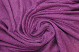 Swirled swatch Mirabella knit fabric in plum (dark purple red)