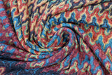 Swirled swatch Stretch Terracotta fabric (vertical wavy line design allover in various colours: burnt orange, burgundy, blue, yellow, green, black, etc.)