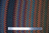 Flat swatch Stretch Terracotta fabric (vertical wavy line design allover in various colours: burnt orange, burgundy, blue, yellow, green, black, etc.)