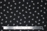 Flat swatch 100% Organic Cotton fabric (black fabric with small white skull heads)