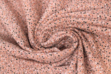 Swirled swatch jersey print fabric with woodland theme in print dots rose (light pink/rose fabric with tiny white/black/grey/pink speckled dots)