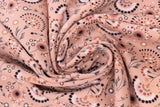 Swirled swatch jersey print fabric with woodland theme in print flowers on rose (light pink/rose fabric with white/black/grey/pink tossed floral designs)