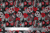 Flat swatch Red Sugar Skulls fabric (black fabric with busy tossed white and grey decorative skulls with red accents and floral allover, sugar skull style)
