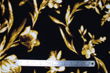 Flat swatch Stretch Floral fabric (black fabric with large tossed cream/yellow monochromatic floral and stems/leaves allover)