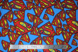 Flat swatch distressed superman logo fabric (bright blue fabric with tossed superman logos in various sizes all with a slight cracked/distressed look that allows for blue to peek through)