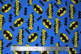 Flat swatch batman trademark fabric (bright medium blue fabric with tossed yellow and black batman logos, black bat silhouettes, and "Batman" text with character behind, tossed allover)