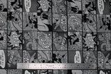 Flat swatch Mickey Mouse comic book printed fabric (black and grey colourway vintage style Mickey Mouse comic book strips with large "BOOM!" etc. text)