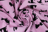 Swirled swatch purrrfectly pink fabric (pink fabric with black cat silhouettes in various styles)