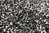 Swirled swatch leopard print fabric (white fabric with tan and black leopard print design)