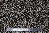 Flat swatch leopard print fabric (white fabric with tan and black leopard print design)