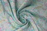 Swirled swatch pressed flowers blue fabric (light blue fabric with tossed small floral heads with lots of stems in white, pink, yellow flowers and green, blue stems)