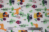 Flat swatch forest friends fabric (white fabric with green trees and pink flowers and colourful woodland creatures: orange deer, pink/purple owls, blue racoons, orange and blue foxes)