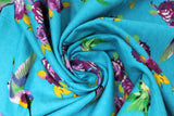 Swirled swatch hummingbirds fabric (bright medium blue fabric with tossed purple floral with yellow/green stems and assorted blue/green/purple/yellow hummingbirds)