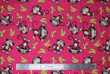 Flat swatch monkey around fabric (bubblegum pink fabric with tossed yellow bananas and brown cartoon monkeys in various poses/faces)