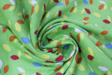 Swirled swatch party lights printed fabric (bright green fabric with tossed christmas lightbulb shaped dots tossed in white, yellow, red, orange, blue)
