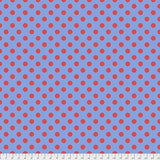 Swatch of pom pom (dots) printed fabric in lupine (blue)